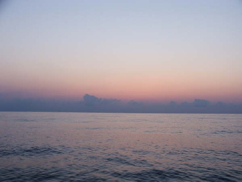 At 0700 we were becalmed on a glassy sea